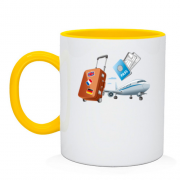 Чашка з літаком, квитками і валізою