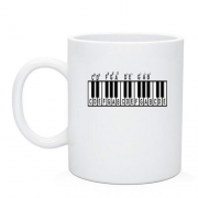 Чашка с клавишами и аккордами